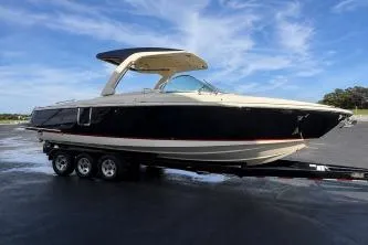Slide: The Image of 2020 Chris-Craft Launch 31 GT interior with beige seating and American flag. - 15