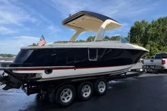 Slide: The Image of Engine compartment of 2020 Chris-Craft Launch 31 GT, showcasing dual powerful engines. - 16
