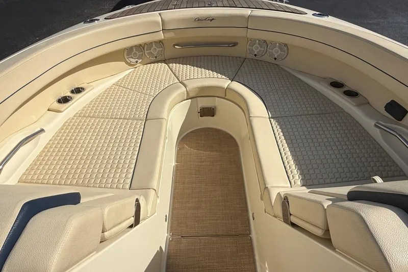 Slide: The Image of 2020 Chris-Craft Launch 31 GT boat with luxurious beige seating and American flag. - 17