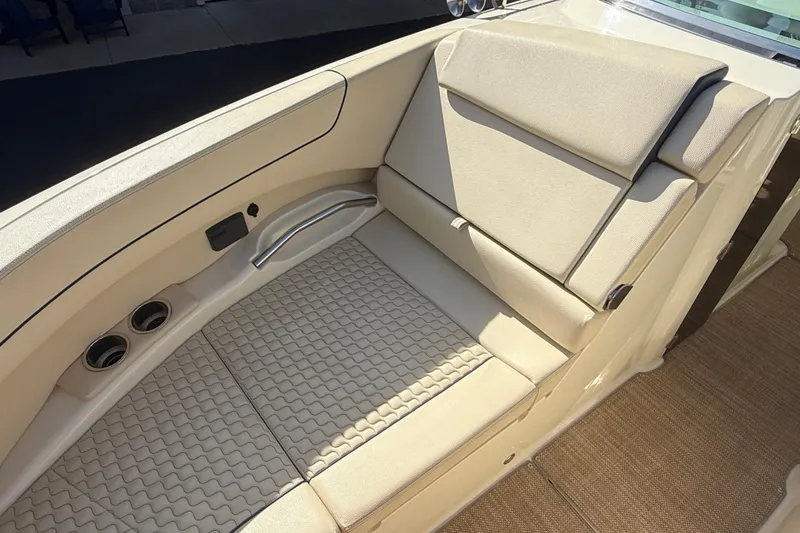 Slide: The Image of Luxurious seating area on 2020 Chris-Craft Launch 31 GT boat, featuring beige upholstery. - 18