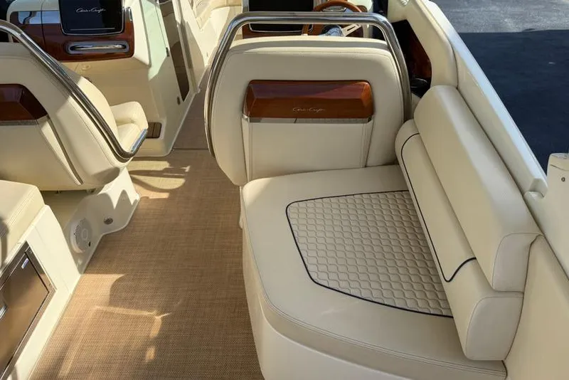Slide: The Image of Luxurious interior of 2020 Chris-Craft Launch 31 GT with elegant beige seating. - 28
