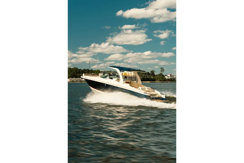 Slide: The Image of 2020 Chris-Craft Launch 31 GT interior with elegant wood and chrome accents. - 9