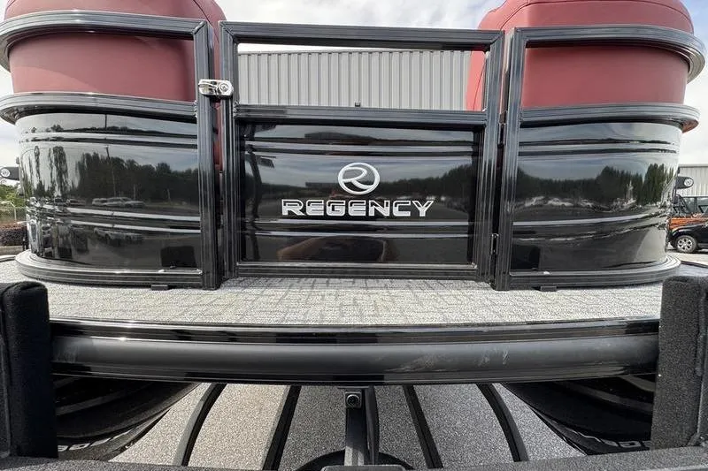 Slide: The Image of 2026 Regency 230 DL pontoon boat with sleek black exterior and red seating. - 11
