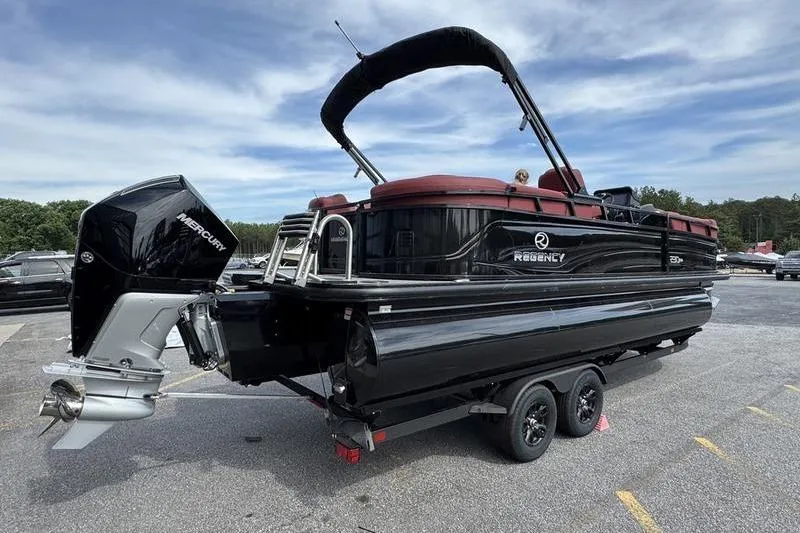 Slide: The Image of 2026 Regency 230 DL pontoon boat on trailer with Mercury outboard motor. - 5