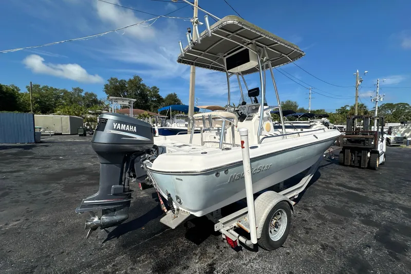 Slide: The Image of 2005 NauticStar 1900 NauticBay boat with Yamaha outboard motor on trailer. - 2