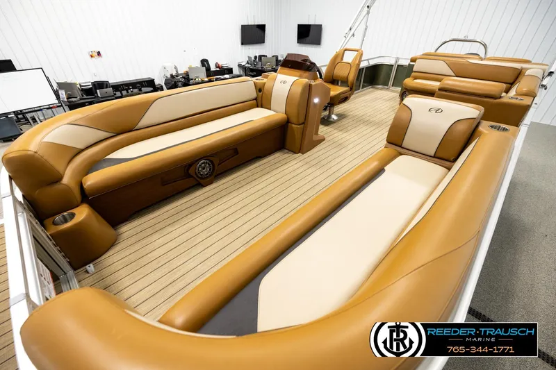 Slide: The Image of Luxurious 2023 Avalon VEN CR boat interior with tan seating and wood flooring. - 10
