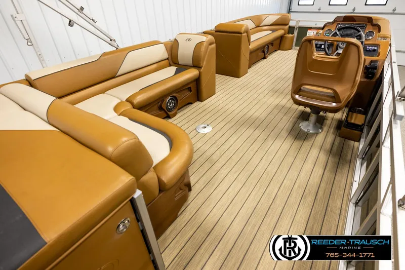 Slide: The Image of Luxurious 2023 Avalon VEN CR boat interior with tan seating and wood-style flooring. - 12