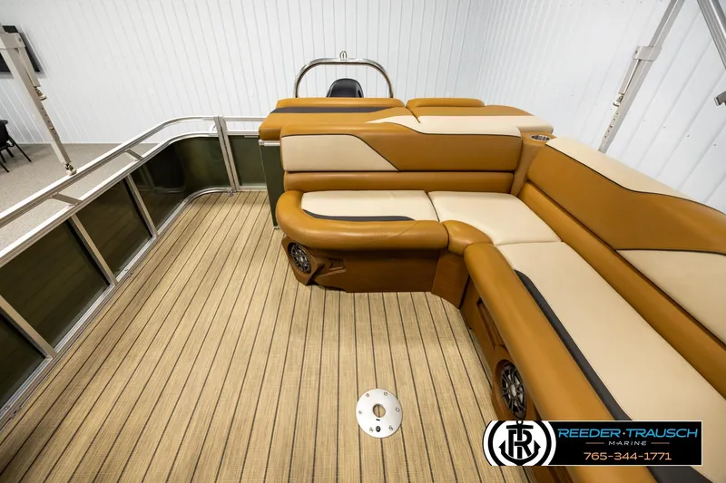 Slide: The Image of Luxurious interior of 2023 Avalon VEN CR boat with tan seating and wood-patterned flooring. - 15