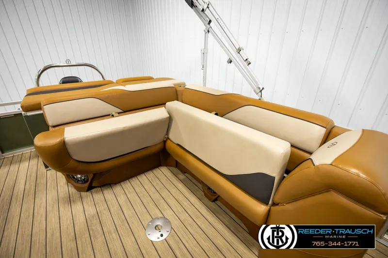 Slide: The Image of 2023 Avalon VEN CR boat interior with tan and cream seating, wooden flooring. - 21