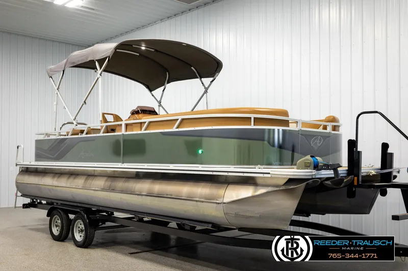 Slide: The Image of 2023 Avalon VEN CR pontoon boat on trailer in indoor storage facility. - 3