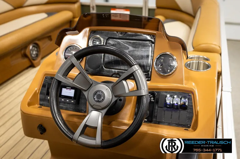 Slide: The Image of 2023 Avalon VEN CR boat dashboard with steering wheel and control panel. - 30
