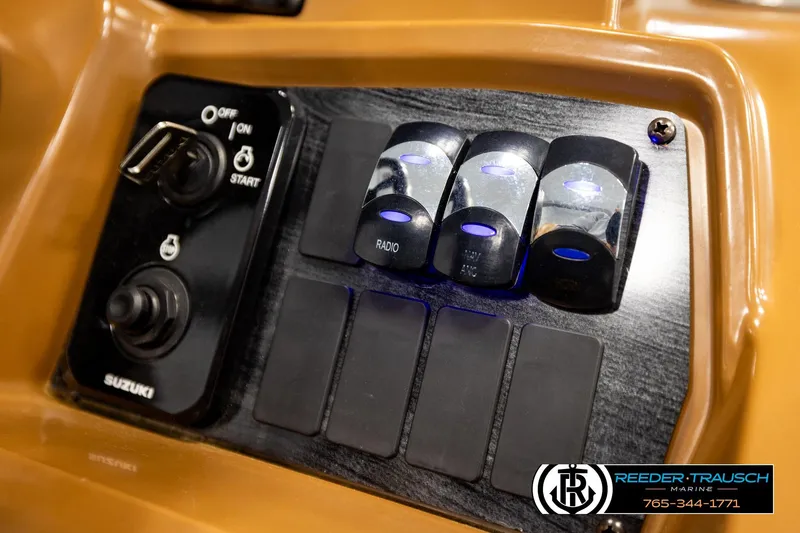 Slide: The Image of Control panel of 2023 Avalon VEN CR boat with Suzuki ignition and switches. - 38