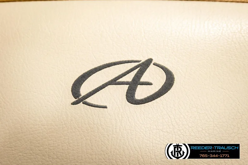 Slide: The Image of Embroidered Avalon logo on beige leather, 2023 VEN CR model by Reeder-Trausch Marine. - 43