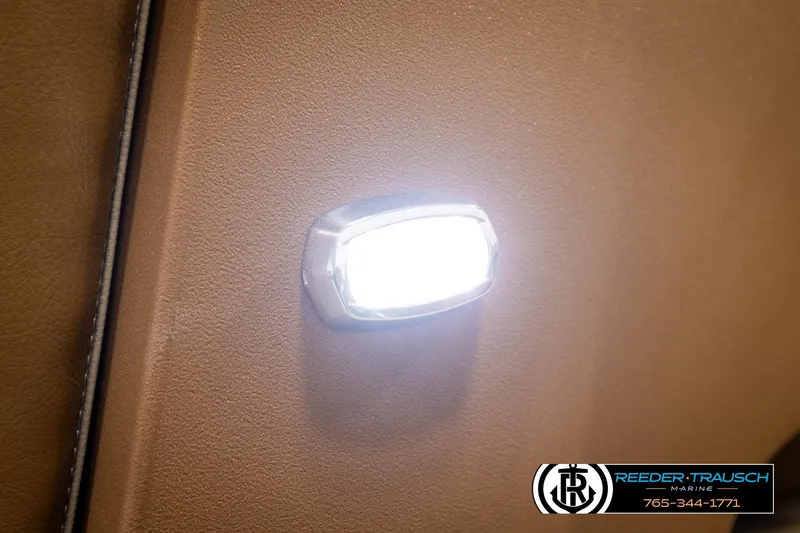 Slide: The Image of LED light on brown interior of 2023 Avalon VEN CR boat. - 44