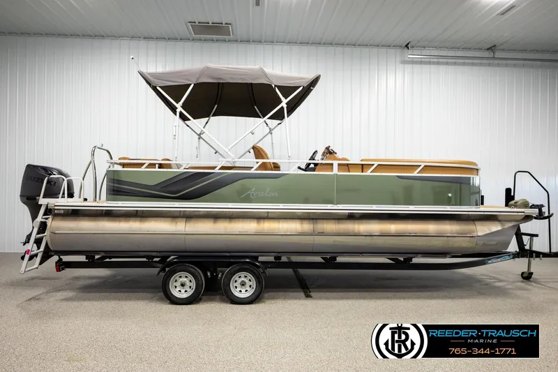 Slide: The Image of 2023 Avalon VEN CR pontoon boat on trailer in indoor showroom. - 5