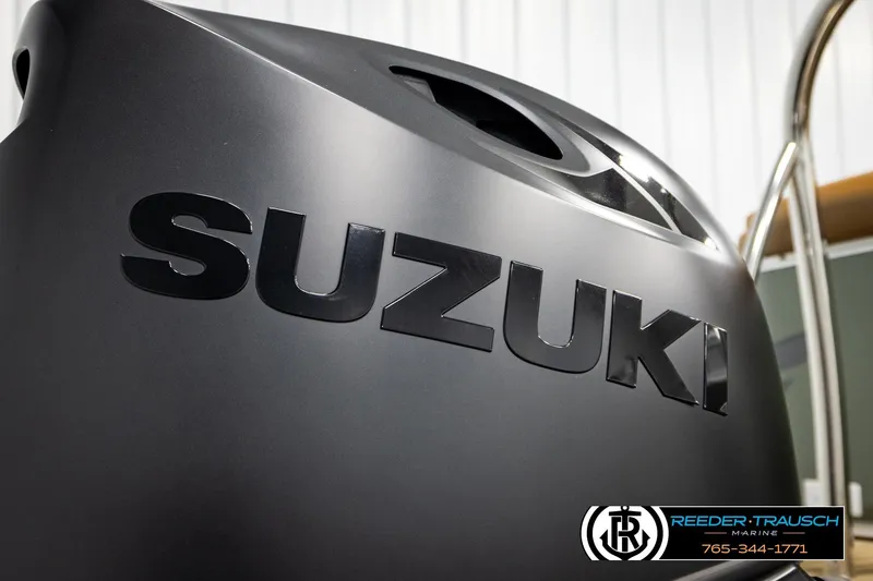 Slide: The Image of ```json "Suzuki engine close-up on 2023 Avalon VEN CR boat by Reeder-Trausch Marine." ``` - 51