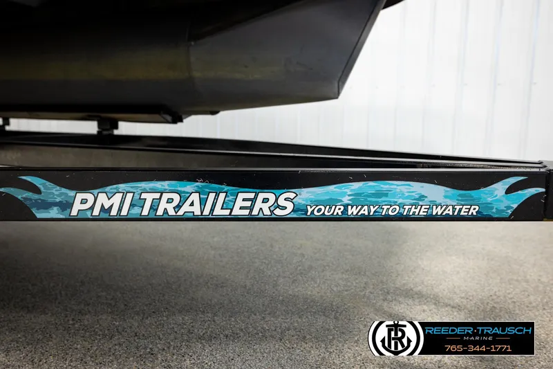 Slide: The Image of PMI Trailers branding on Avalon VEN CR 2023 model, Reeder-Trausch Marine contact info visible. - 54