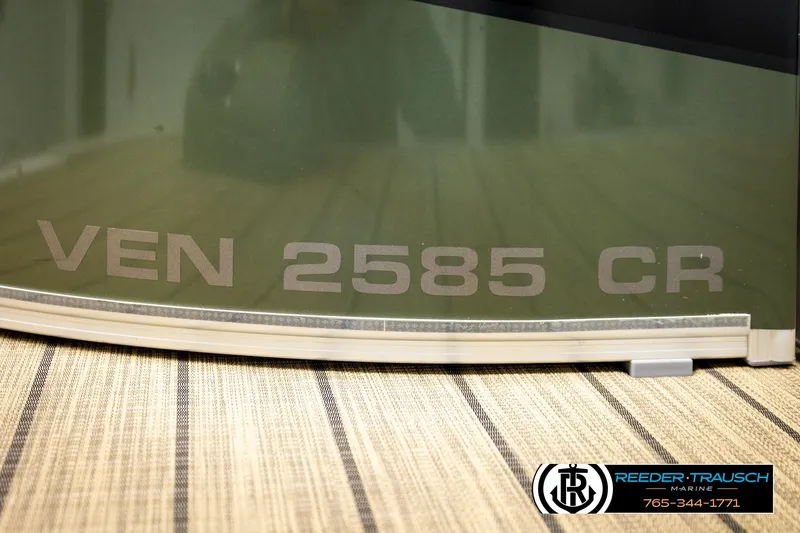 Slide: The Image of 2023 Avalon VEN 2585 CR boat detail with Reeder-Trausch Marine branding. - 56