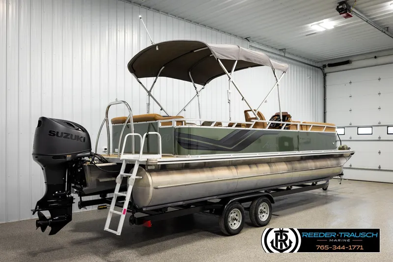 Slide: The Image of 2023 Avalon VEN CR pontoon boat with Suzuki motor in indoor showroom. - 6