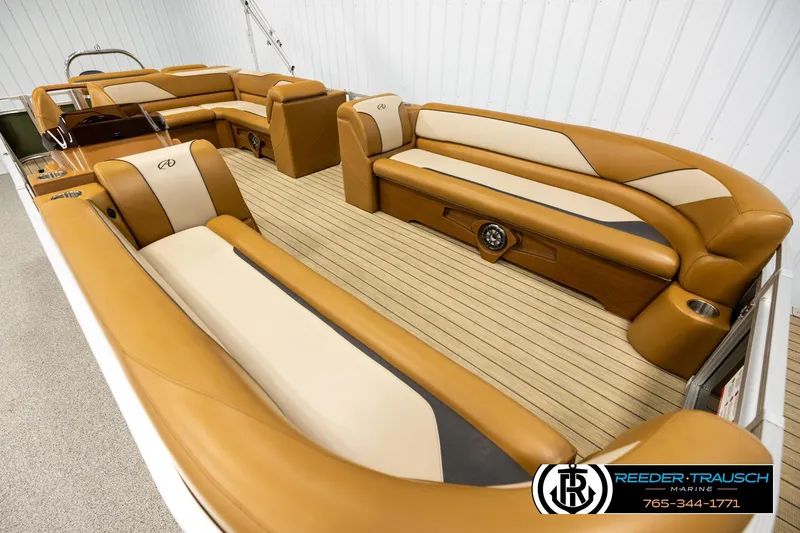 Slide: The Image of Luxurious 2023 Avalon VEN CR boat interior with tan and cream seating, showcasing elegant design. - 9