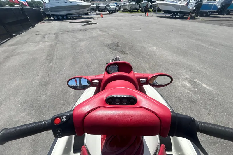 Slide: The Image of 1999 Sea Doo Jet Ski dashboard view at a marina with boats in background. - 11