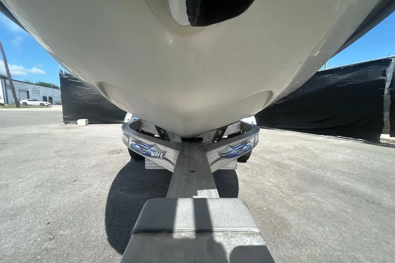 Slide: The Image of 1999 Sea Doo Jet Ski on trailer, viewed from below, outdoors. - 17