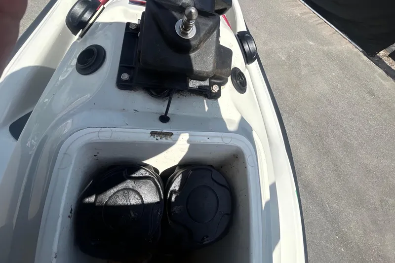 Slide: The Image of 1999 Sea-Doo GSX jet ski with storage compartment lid. - 18