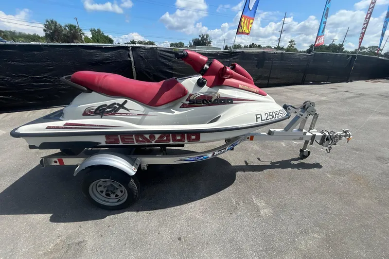 Slide: The Image of 1999 Sea Doo Jet Ski GSX on trailer, red seat, outdoor display. - 20