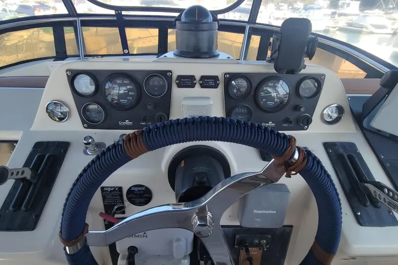 Slide: The Image of Cockpit of 1989 Navigator 34 Flybridge with steering wheel and instrument panel. - 6