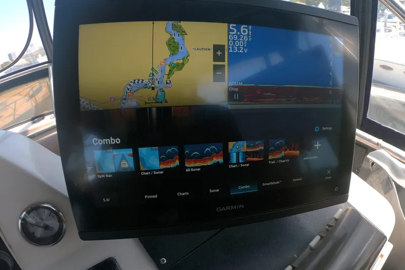 Slide: The Image of Garmin navigation display on 1989 Navigator 34 Flybridge, showing map and sonar options. - 7