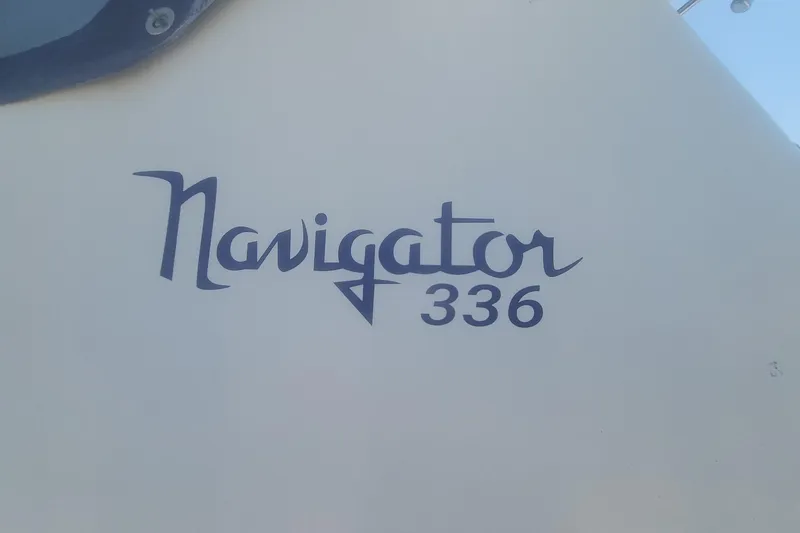 Slide: The Image of Navigator 336 logo on 1989 Navigator 34 Flybridge boat exterior. - 25
