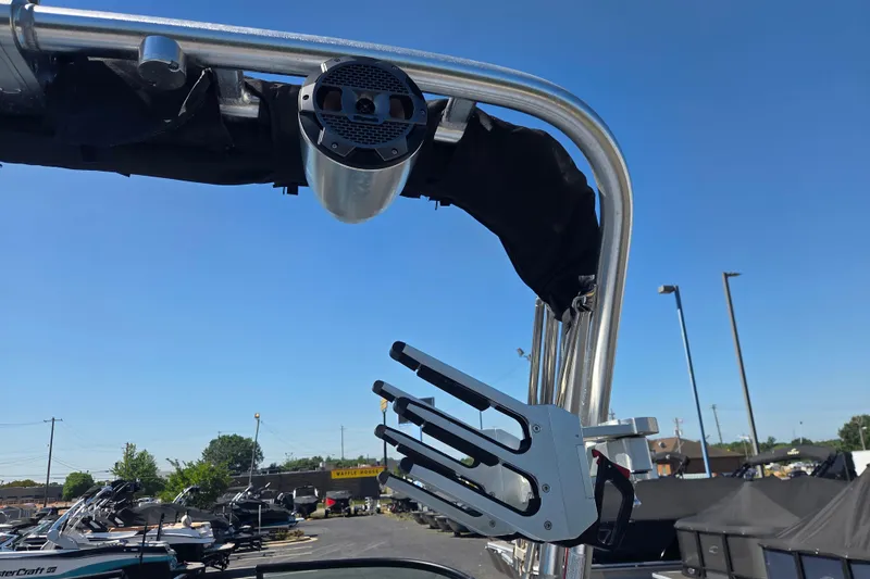 Slide: The Image of 2022 MasterCraft NXT24 boat tower with speaker and wakeboard rack under clear blue sky. - 14