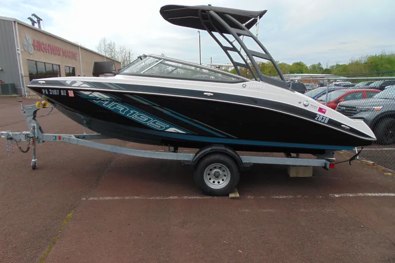 Slide: The Image of 2021 Yamaha Boats AR195 on trailer at dealership parking lot. - 3