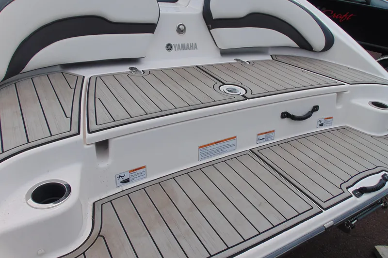 Slide: The Image of 2021 Yamaha Boats AR195 swim platform with teak-style decking and seating. - 5