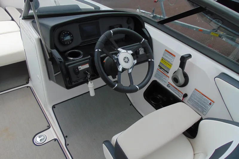 Slide: The Image of 2021 Yamaha Boats AR195 cockpit with steering wheel and control panel. - 7