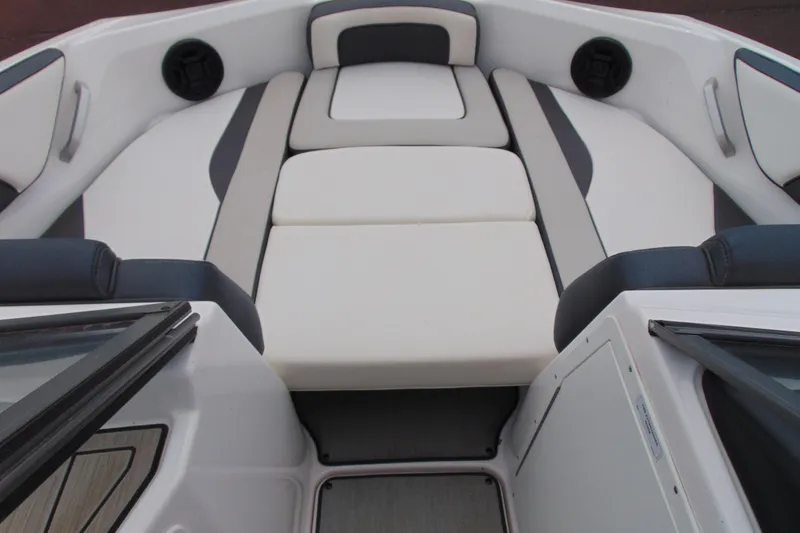 Slide: The Image of 2021 Yamaha Boats AR195 interior with cushioned seating and sleek design. - 9