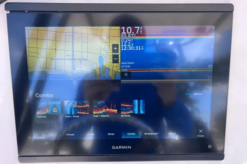 Slide: The Image of Garmin marine display on 2023 Twin Vee 240 GFX CC showing navigation and sonar data. - 25