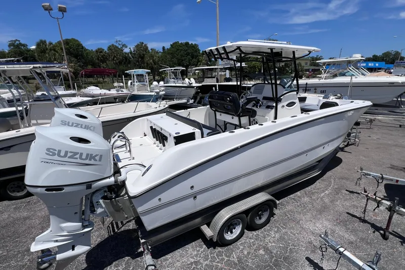 Slide: The Image of 2023 Twin Vee 240 GFX CC boat with Suzuki engines on a trailer. - 3