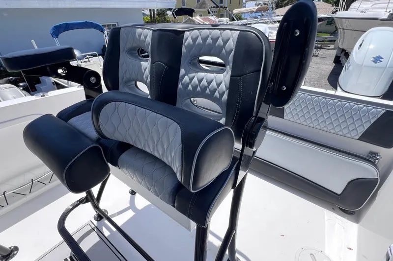 Slide: The Image of 2023 Twin Vee 240 GFX CC boat seat with quilted upholstery and armrests. - 31