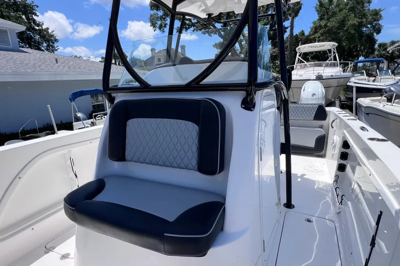 Slide: The Image of 2023 Twin Vee 240 GFX CC boat interior with cushioned seating and sleek design. - 36
