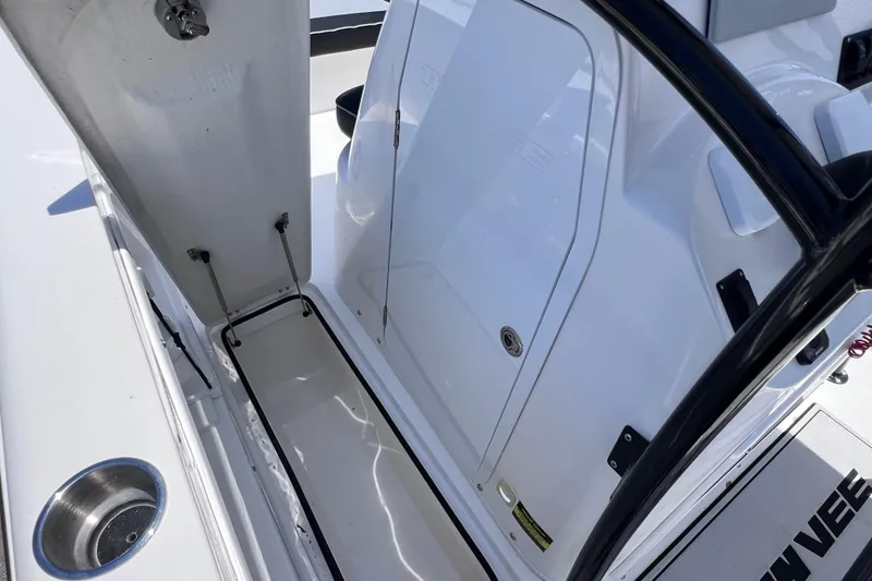Slide: The Image of 2023 Twin Vee 240 GFX CC boat interior storage compartment with open hatch. - 37