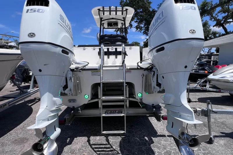 Slide: The Image of 2023 Twin Vee 240 GFX CC boat with dual Suzuki 150 engines, rear view. - 41