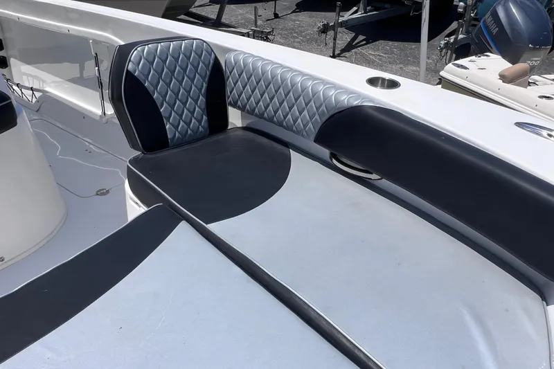 Slide: The Image of 2023 Twin Vee 240 GFX CC boat interior with stylish seating and quilted upholstery. - 43