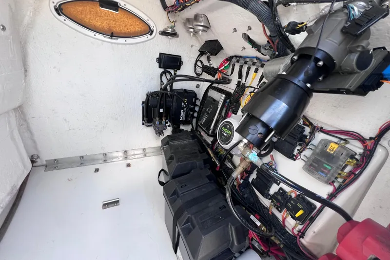 Slide: The Image of Interior view of 2023 Twin Vee 240 GFX CC boat's electrical and mechanical systems. - 46