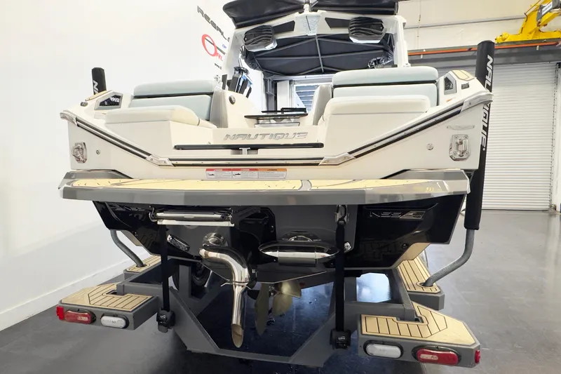 Slide: The Image of 2020 Nautique Super Air Nautique G23 Paragon boat, rear view in showroom. - 4