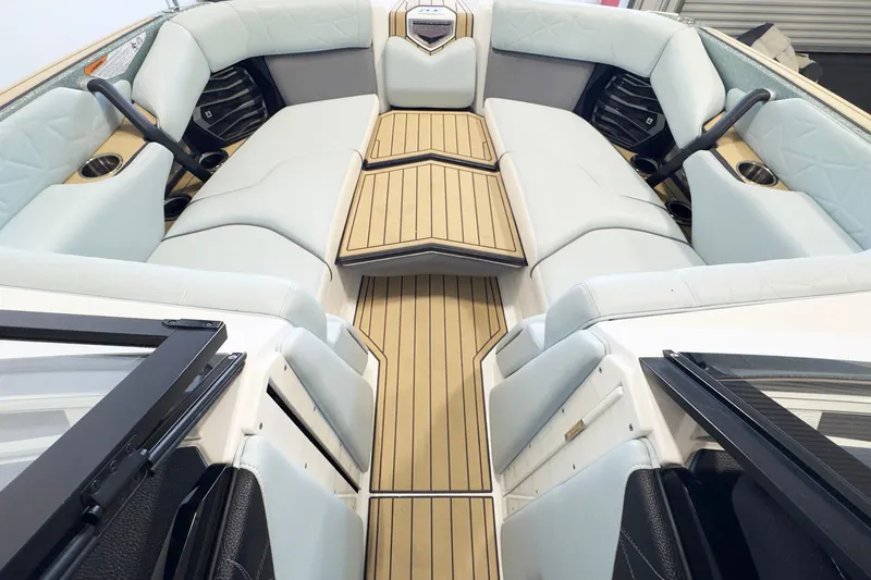 Slide: The Image of 2020 Nautique Super Air Nautique G23 Paragon interior with luxurious seating and teak flooring. - 7