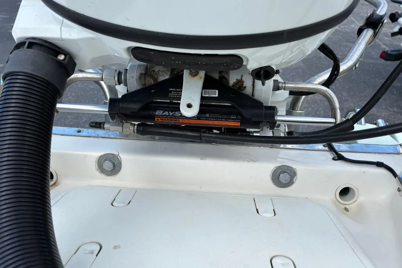 Slide: The Image of 2021 Sundance DX22 boat engine steering mechanism close-up. - 20