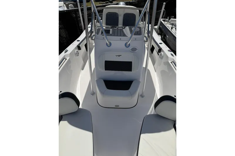 Slide: The Image of 2024 Tidewater 198 CC Adventure boat interior with seating and console. - 14