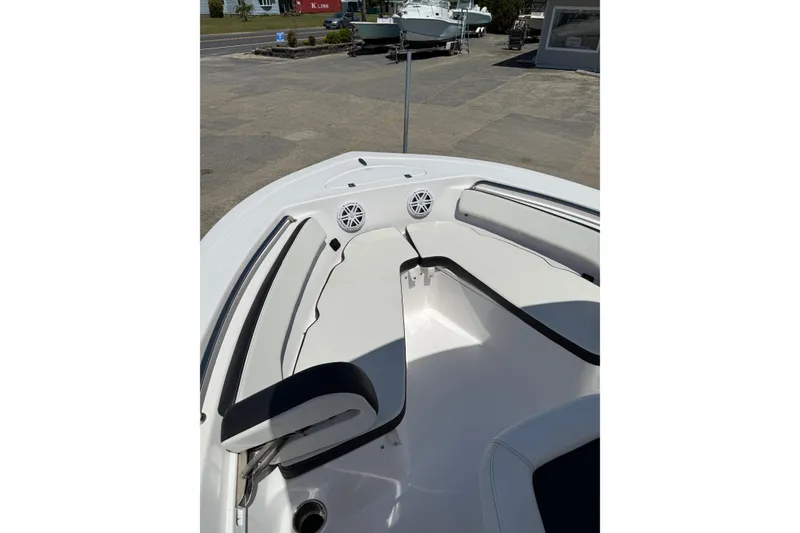 Slide: The Image of 2024 Tidewater 198 CC Adventure boat interior with seating and speakers. - 15