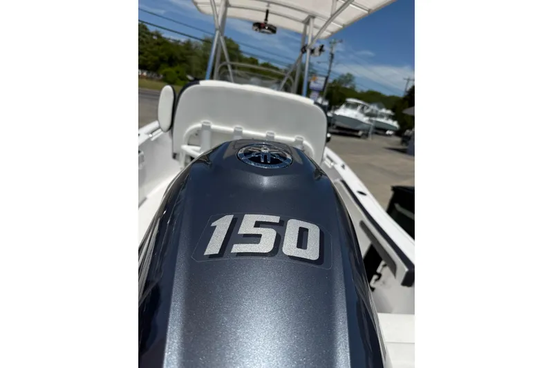 Slide: The Image of 2024 Tidewater 198 CC Adventure boat with 150 horsepower engine, outdoor display. - 18